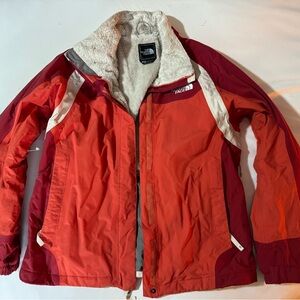 Women’s medium North Face red/burnt orange jacket. Great for cold weather!